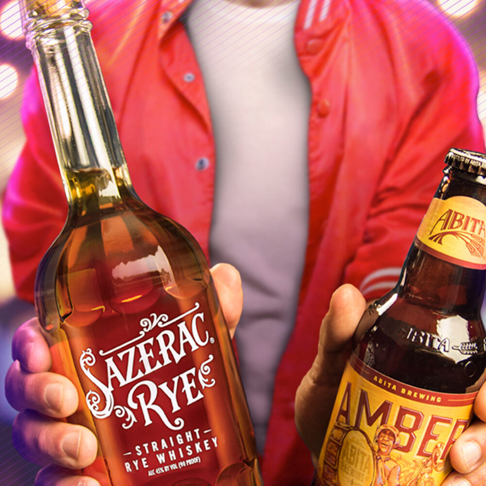Two Hands Holding Sazerac Rye Whiskey and Abita Amber Beer